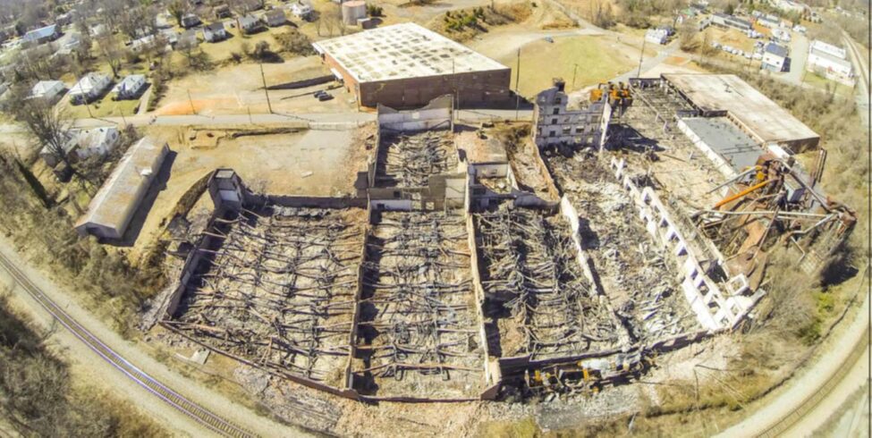 Aerial view of a destroyed furniture manufacturing facility