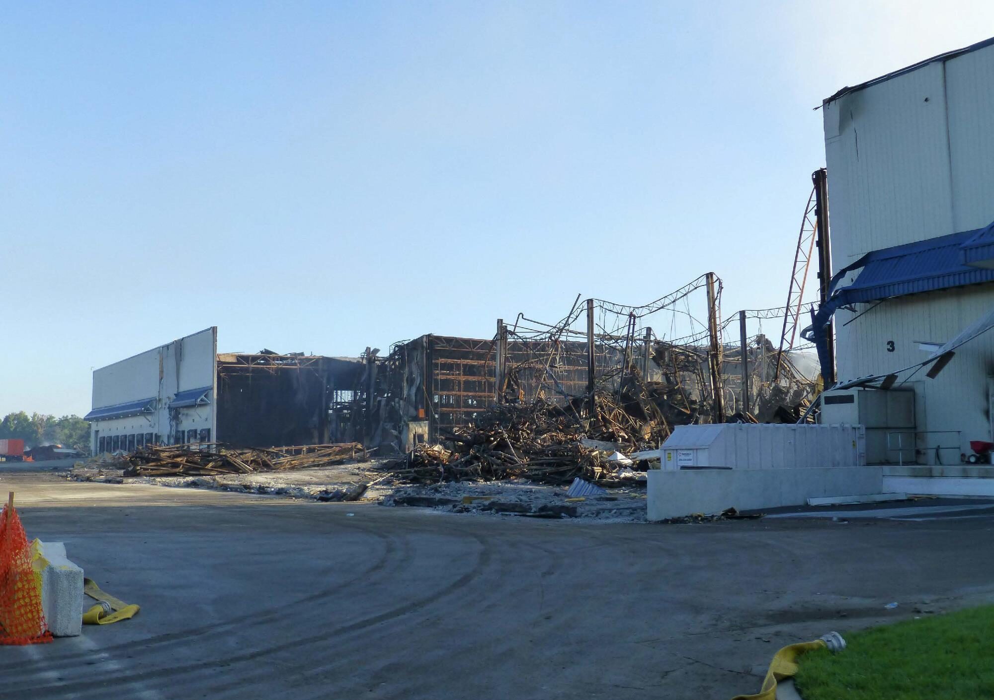 Fire-damaged industrial facility under investigation